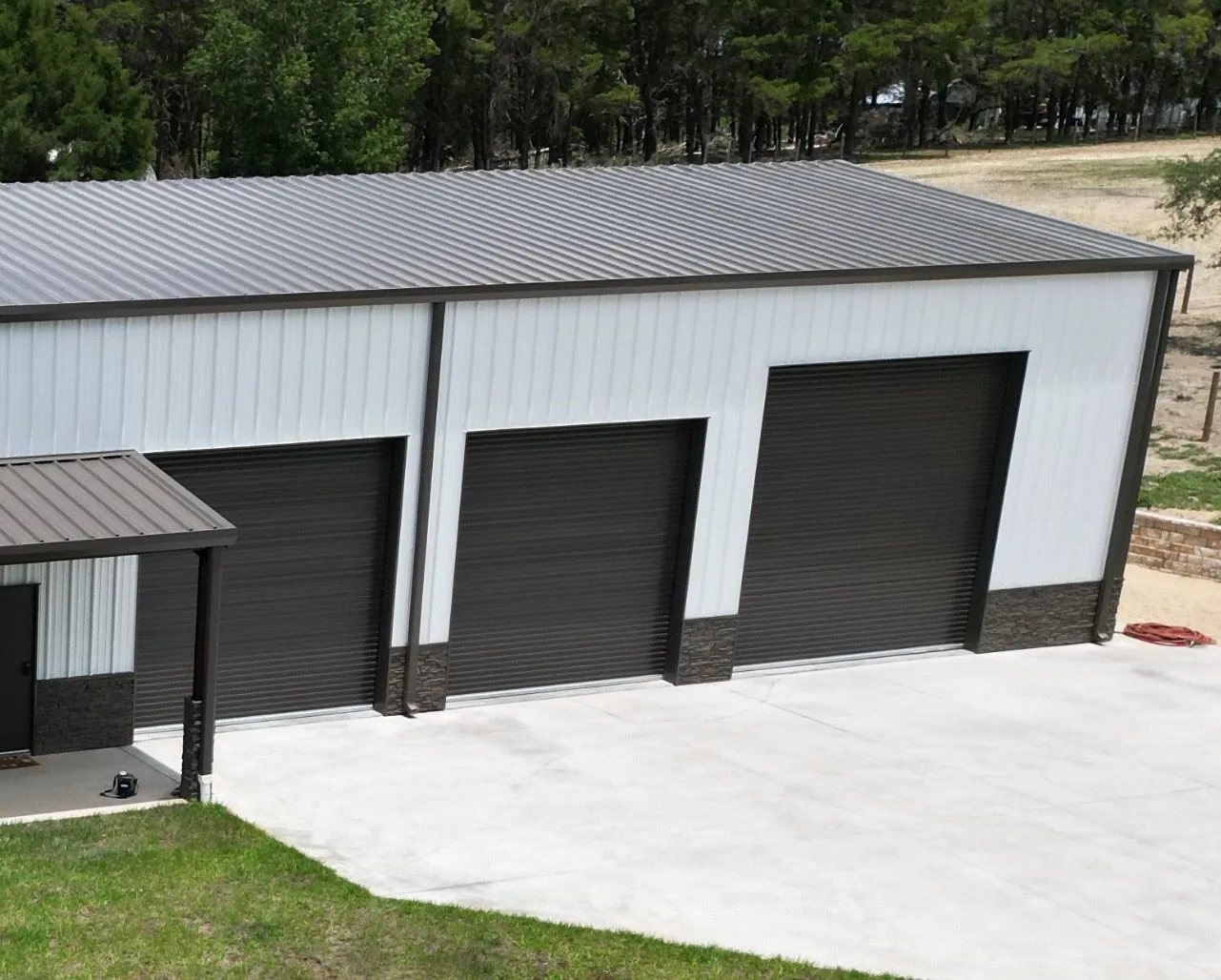 A windload-rated roll-up door hung in a finished Chambliss steel building