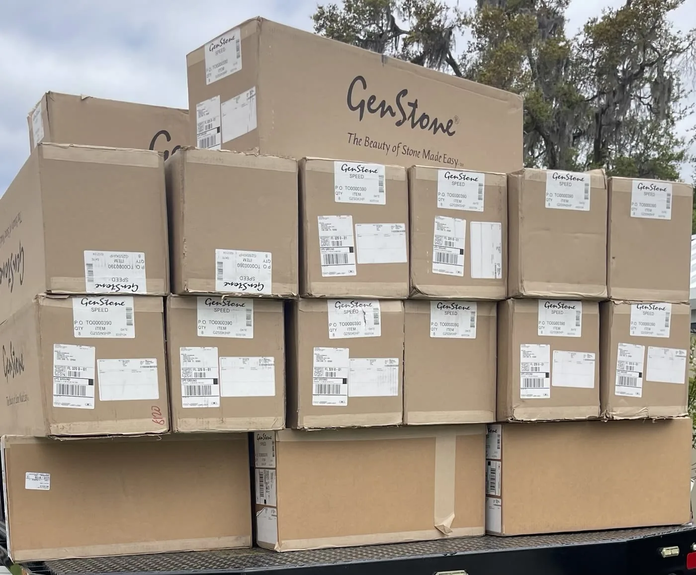 A trailer load of stone panel boxes delivered to a Chambliss job site